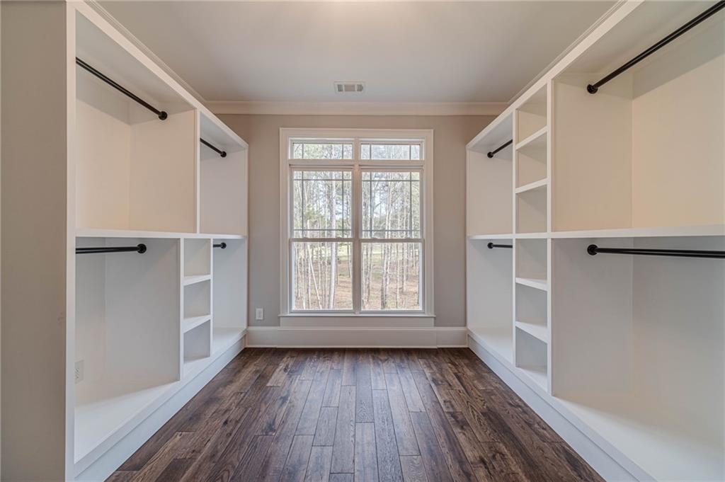 4720 Bold Springs Road Monroe, GA 30656 - Photo 41 of 83 a view of an empty room with wooden floor and a window