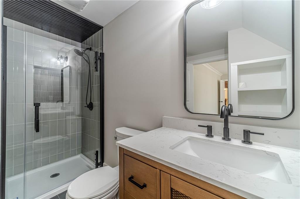 4720 Bold Springs Road Monroe, GA 30656 - Photo 46 of 83 a bathroom with a sink a toilet and shower