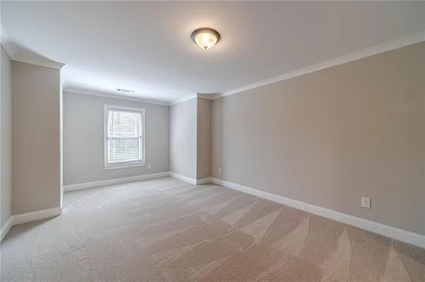a view of a house with backyard and trees
