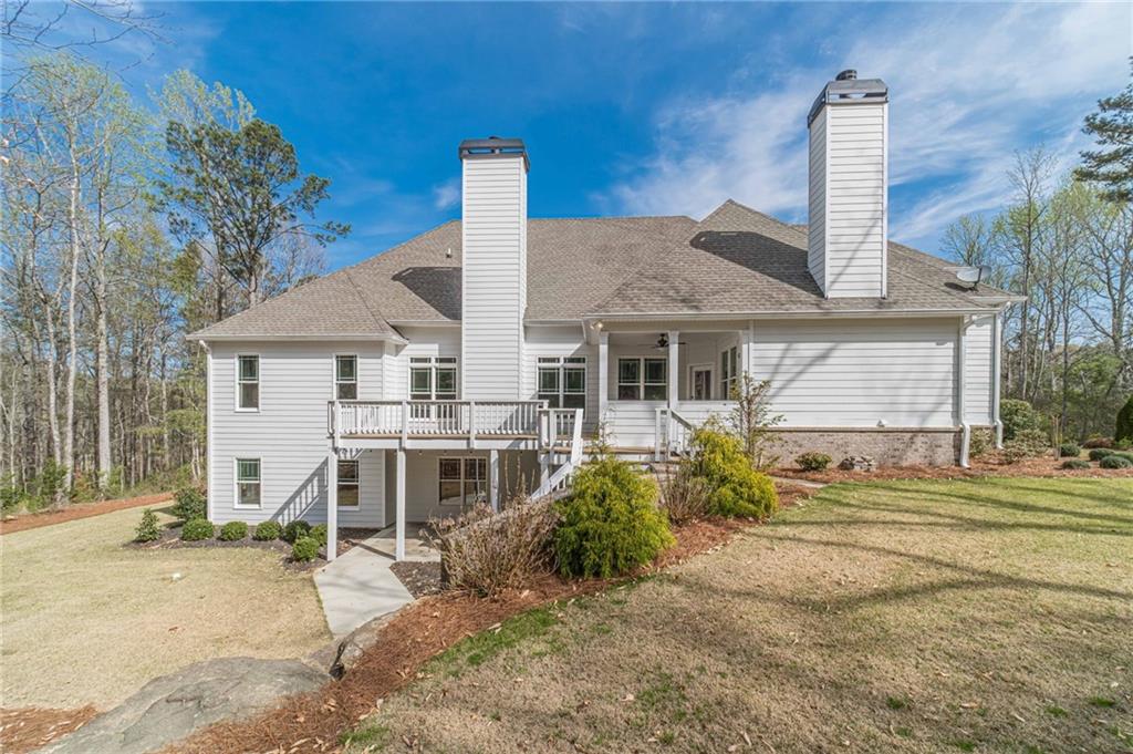 4720 Bold Springs Road Monroe, GA 30656 - Photo 68 of 83 a front view of a house with a garden and trees