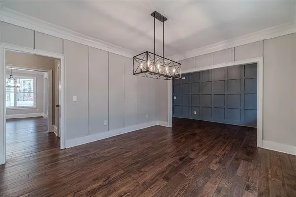 a kitchen with kitchen island granite countertop a sink cabinets and stainless steel appliances