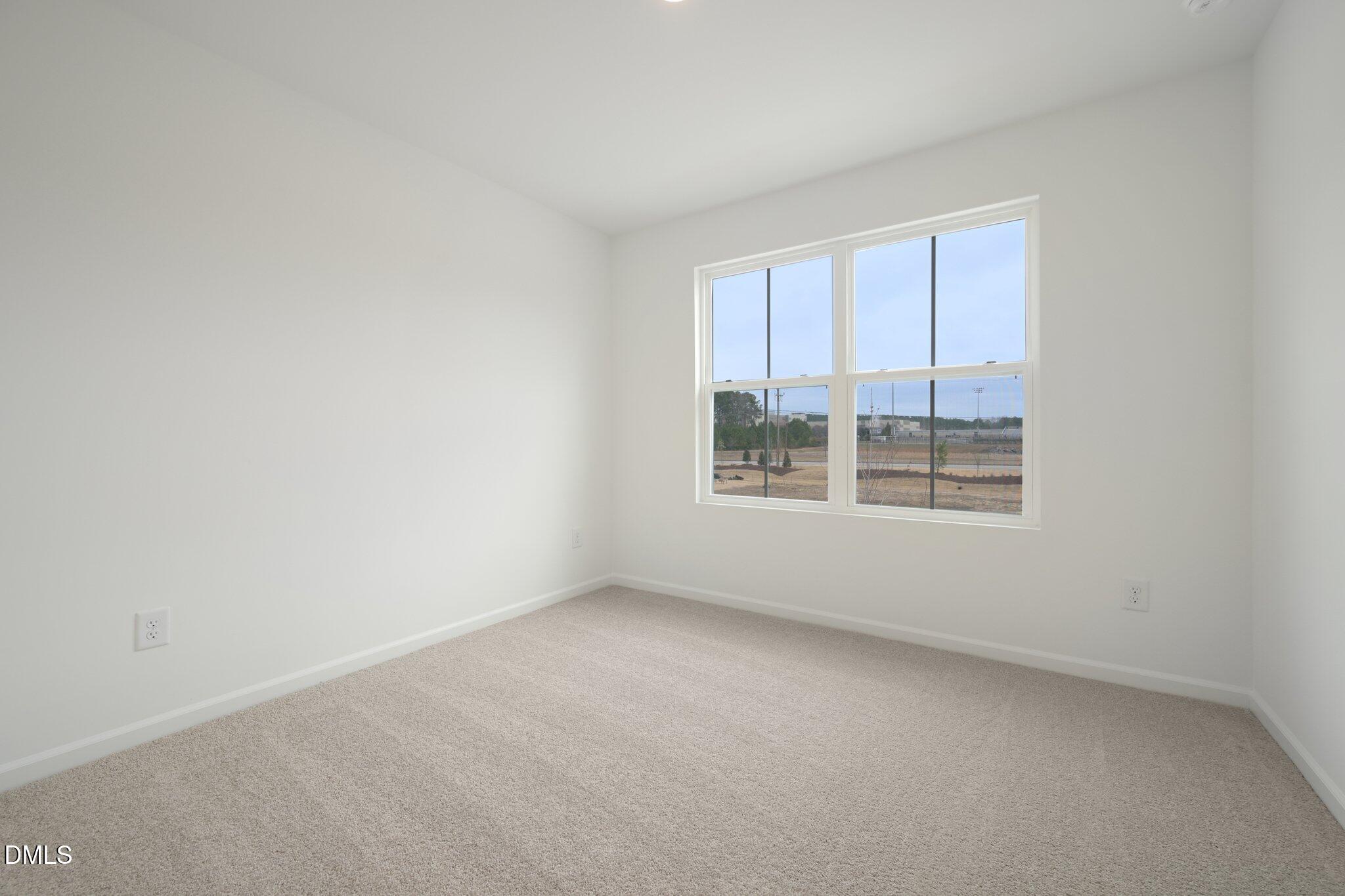 1522 Mirth Court Rolesville, NC 27571 - Photo 13 of 34 an empty room with windows