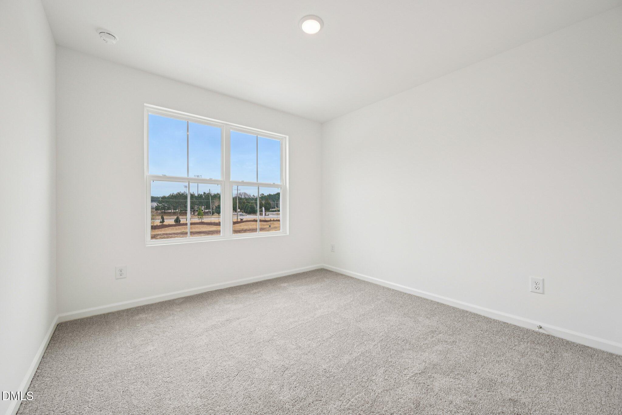 1522 Mirth Court Rolesville, NC 27571 - Photo 14 of 34 a view of a room that has a window in it