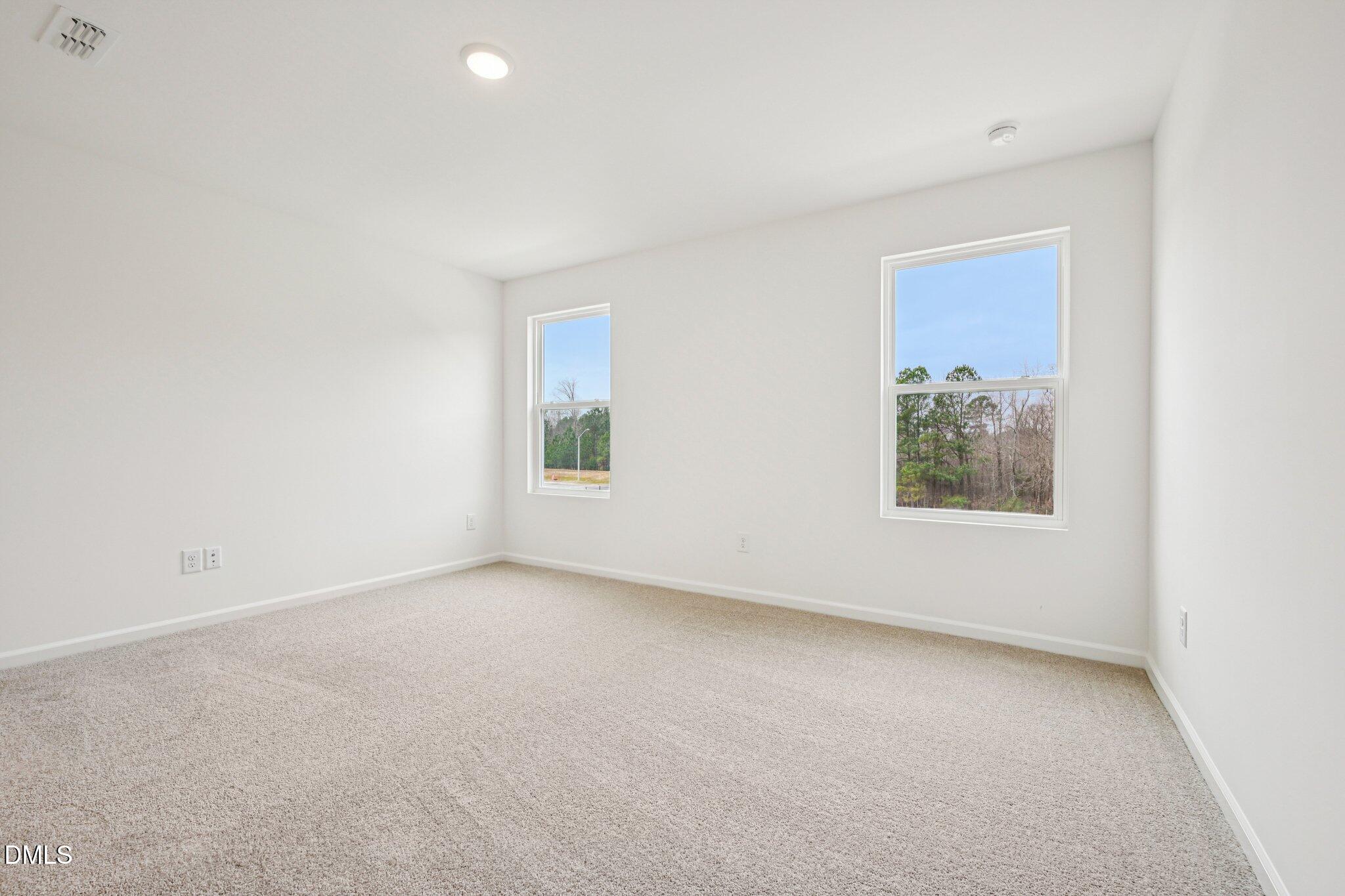 1522 Mirth Court Rolesville, NC 27571 - Photo 18 of 34 an empty room with a window