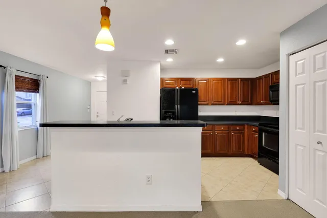 a view of kitchen with wooden floor