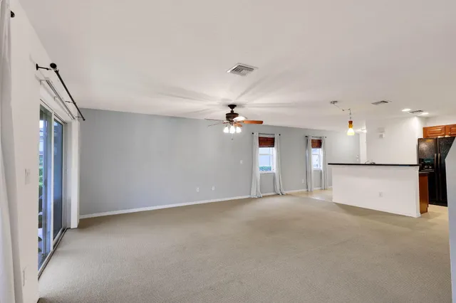 a view of a kitchen with a sink and a chandelier