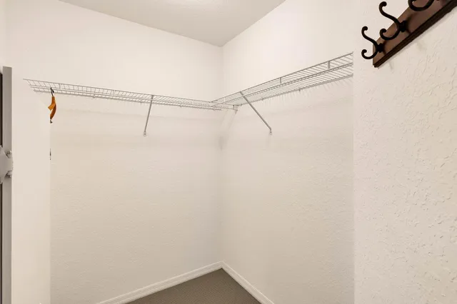 a view of a room with racks on the wall
