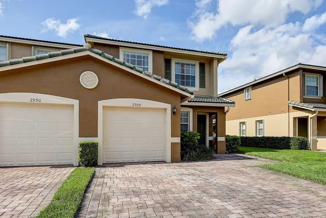 a view of a house with a street