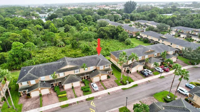 an aerial view of a house with a mountain view