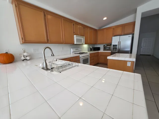 a bathroom with a sink a mirror and a shower
