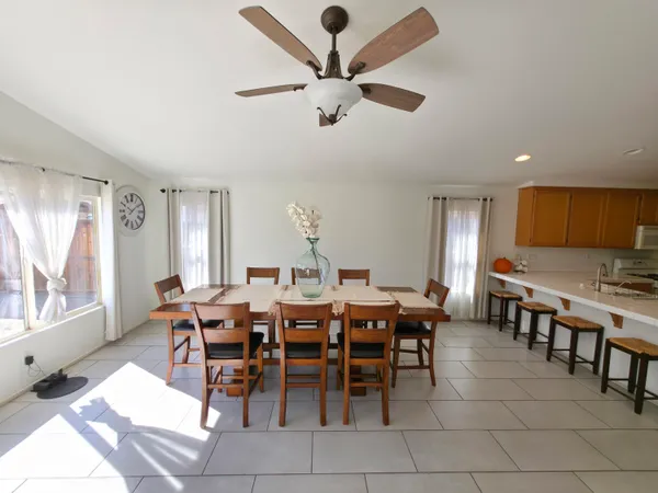 a kitchen with stainless steel appliances granite countertop a sink stove refrigerator and cabinets
