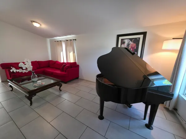 a dining room with furniture and window