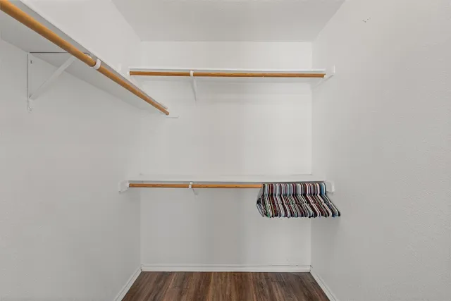 a view of utility room with racks on the wall