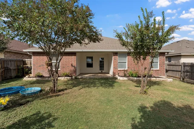 a backyard of a house with seating space