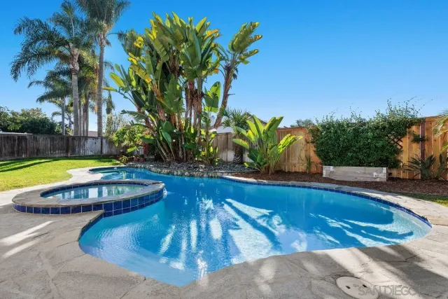 a view of a swimming pool with lounge chair