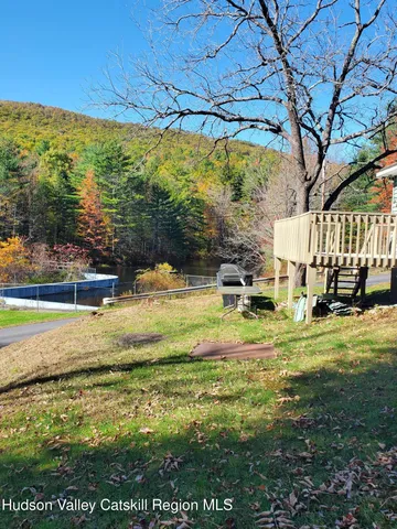 a view of a swimming pool with an outdoor space and seating area