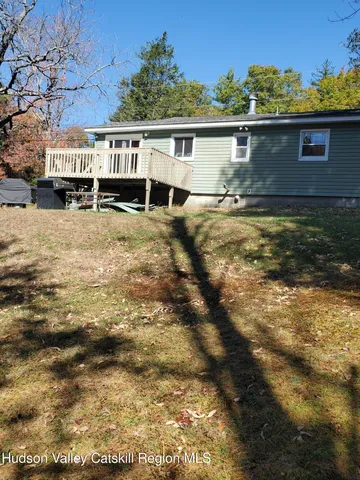 a view of house with yard