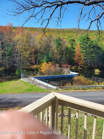 a view of a lake with a house in the background