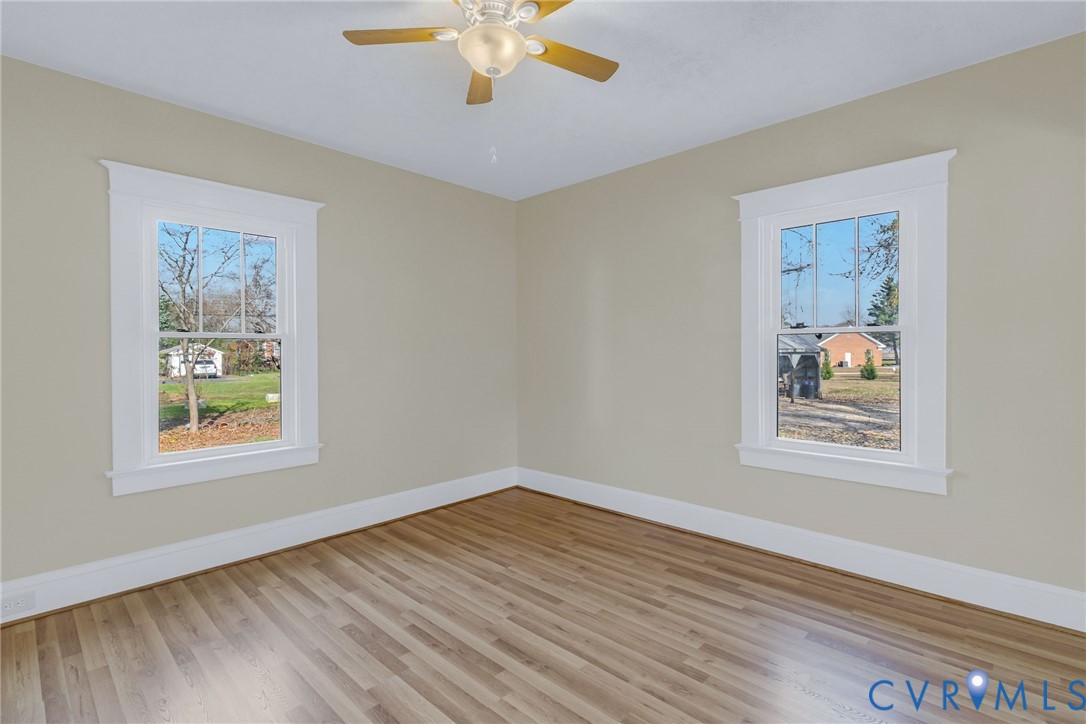 109 Courthouse Road Heathsville, VA 22473 - Photo 16 of 50 a view of an empty room with wooden floor and a window