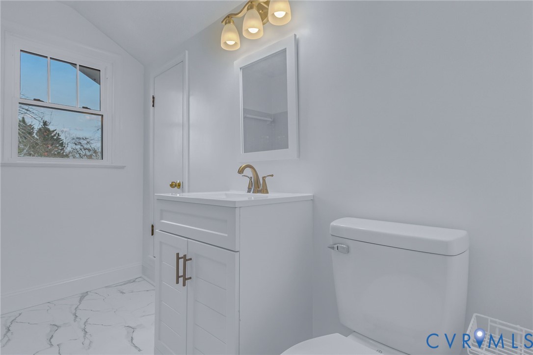 109 Courthouse Road Heathsville, VA 22473 - Photo 22 of 50 a bathroom with a sink a toilet and a mirror