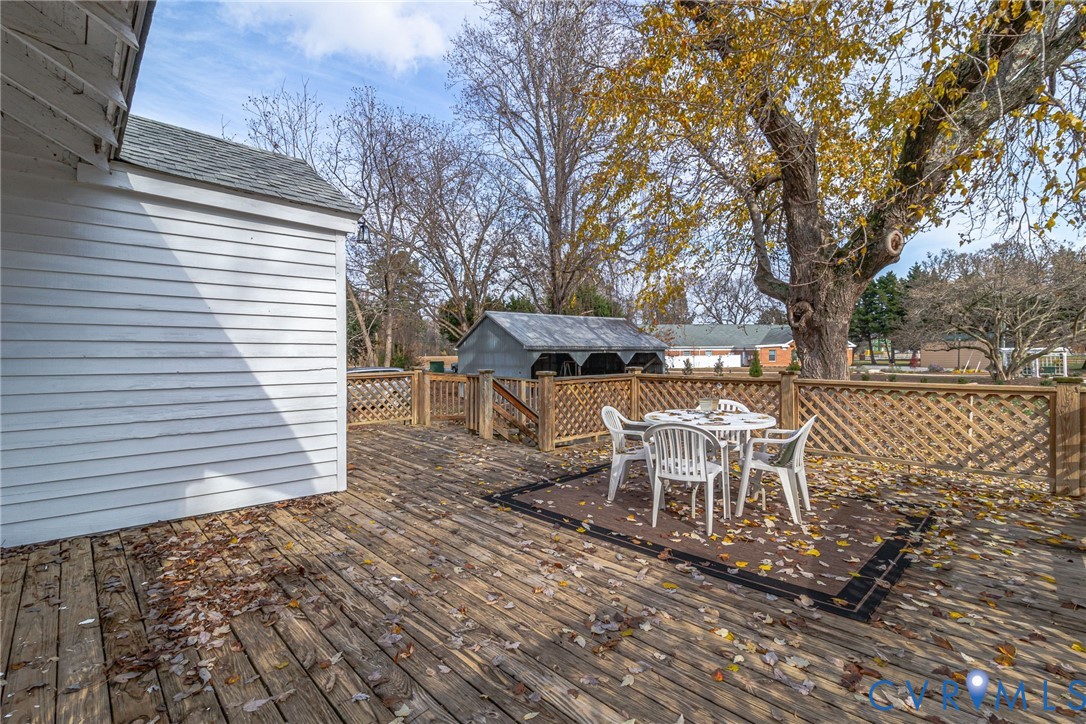109 Courthouse Road Heathsville, VA 22473 - Photo 31 of 50 a backyard of a house with table and chairs
