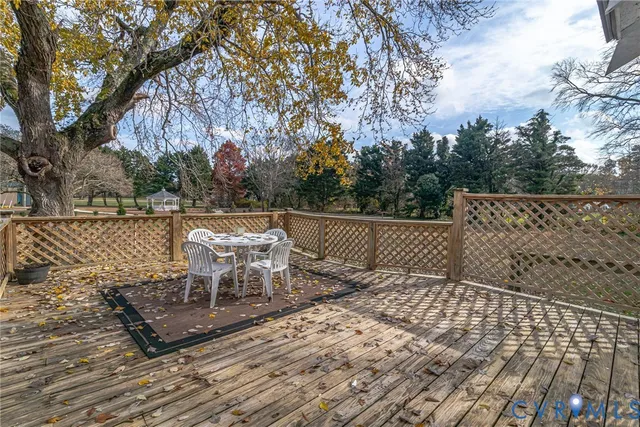 a view of a chairs and table on the wooden floor