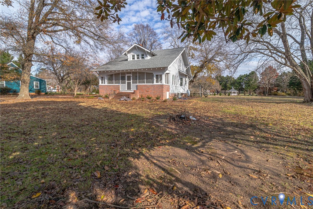 109 Courthouse Road Heathsville, VA 22473 - Photo 40 of 50 a front view of a house with a yard and trees