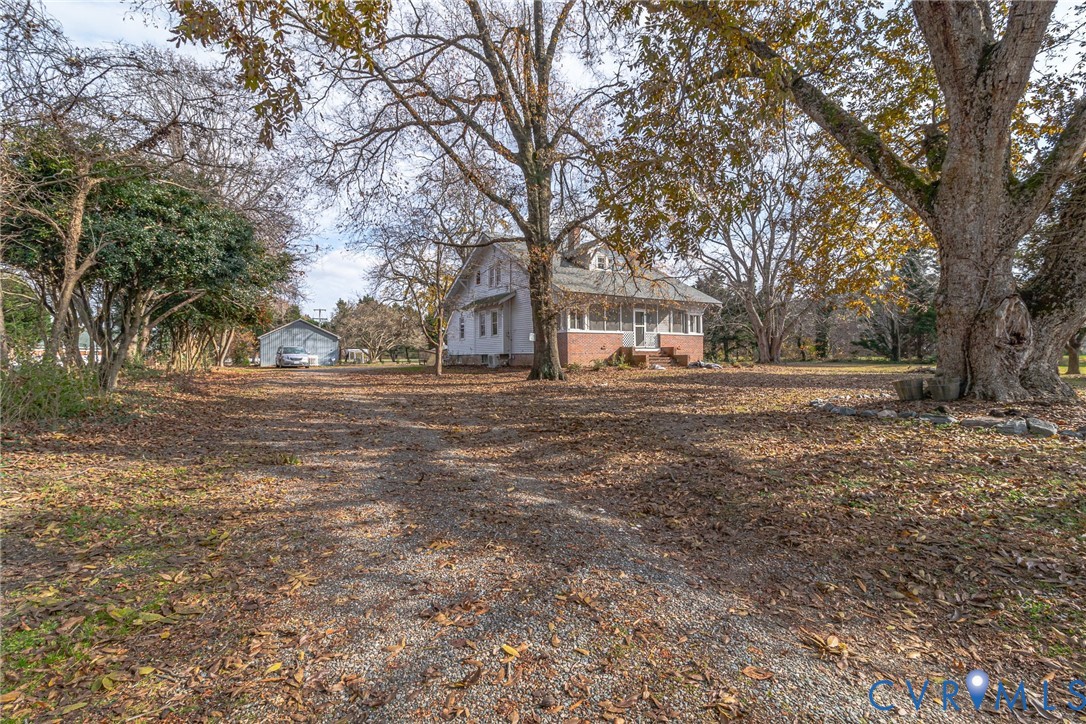 109 Courthouse Road Heathsville, VA 22473 - Photo 41 of 50 a backyard of apartments with large trees