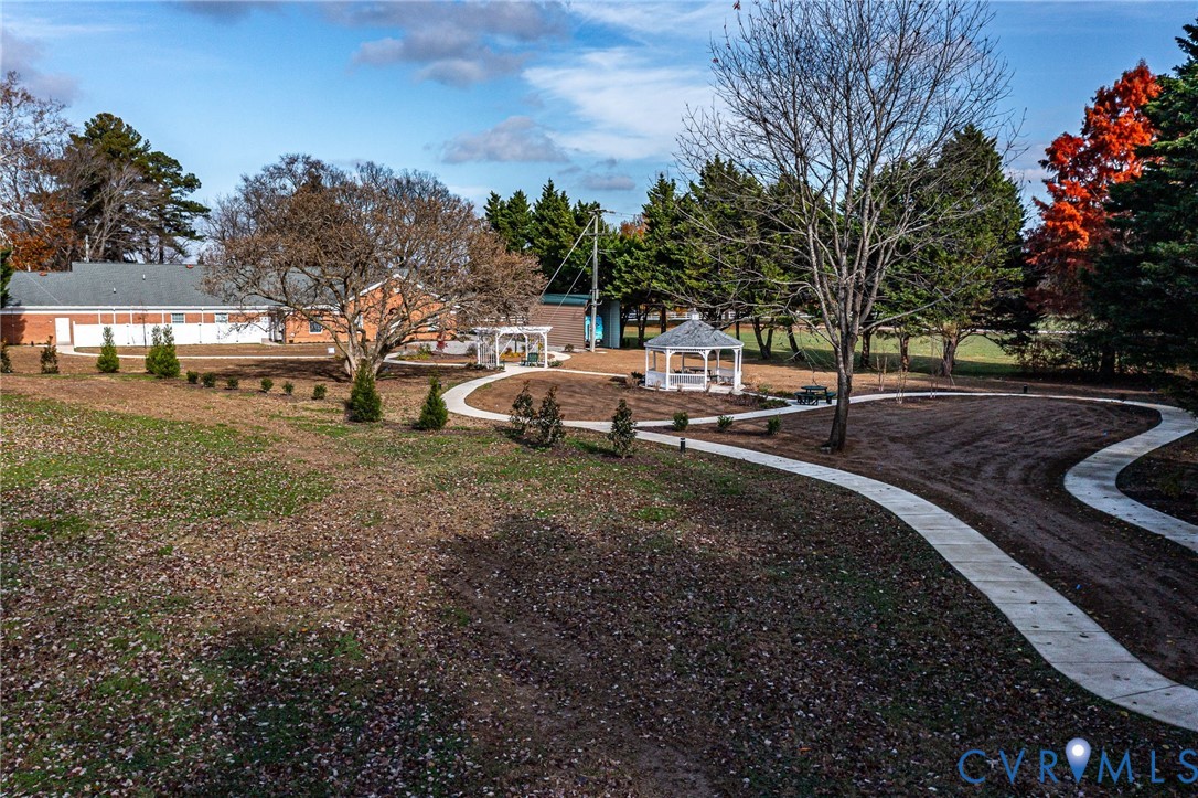 109 Courthouse Road Heathsville, VA 22473 - Photo 50 of 50 a view of a backyard with table and chairs and a fire pit
