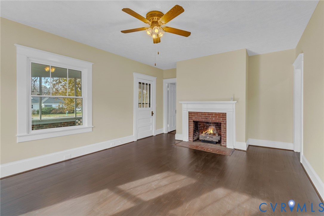 109 Courthouse Road Heathsville, VA 22473 - Photo 6 of 50 a view of an empty room with window and fireplace