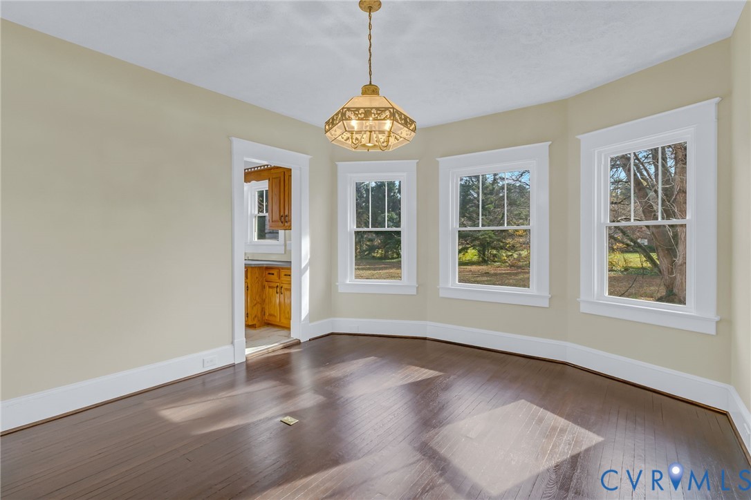 109 Courthouse Road Heathsville, VA 22473 - Photo 8 of 50 an empty room with wooden floor and windows