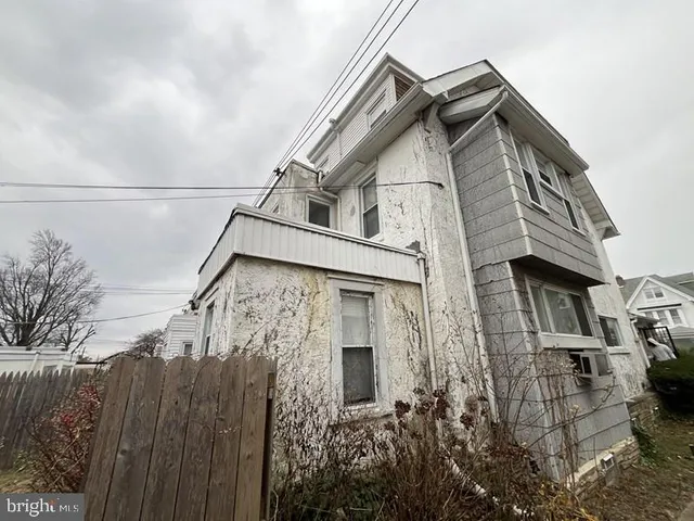 a view of a house with a small yard