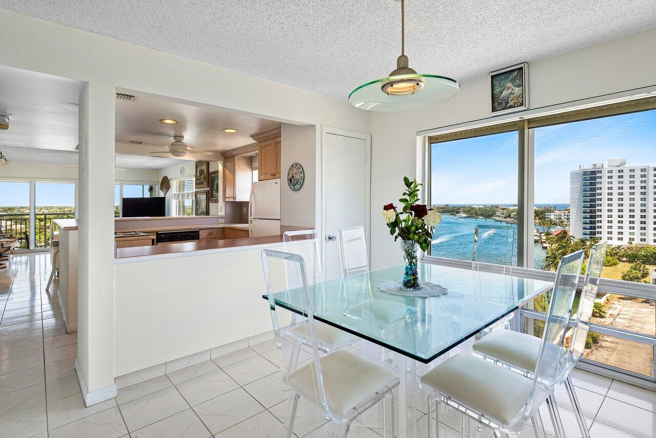 2611 North Riverside Drive, Unit 908 Pompano Beach, FL 33062 - Photo 18 of 43 a kitchen with stainless steel appliances granite countertop a refrigerator a stove and a sink