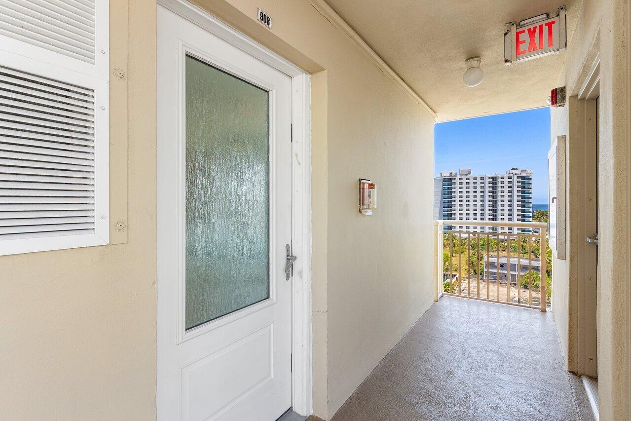 2611 North Riverside Drive, Unit 908 Pompano Beach, FL 33062 - Photo 24 of 43 a view of hallway with wooden floor
