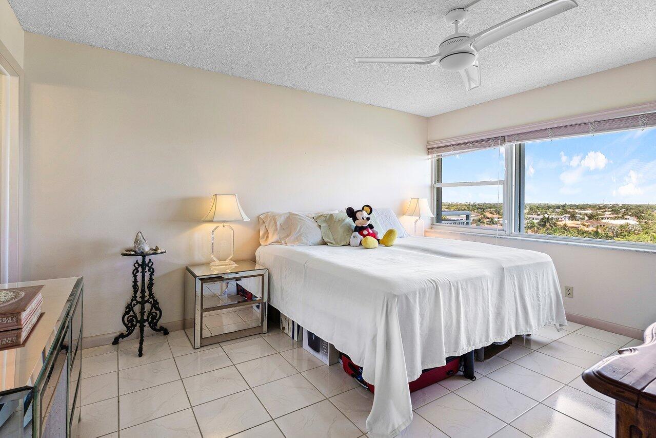 2611 North Riverside Drive, Unit 908 Pompano Beach, FL 33062 - Photo 25 of 43 a bedroom with a bed and a window