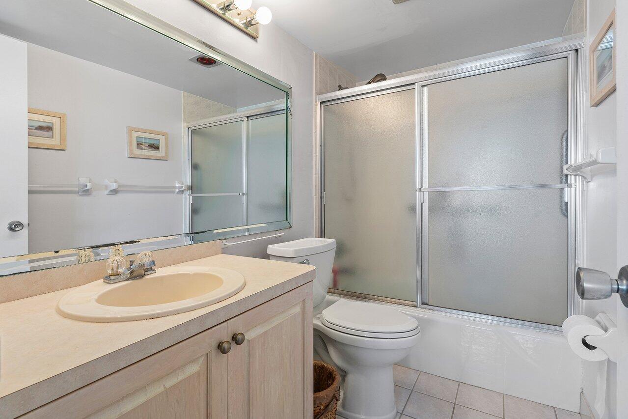 2611 North Riverside Drive, Unit 908 Pompano Beach, FL 33062 - Photo 27 of 43 a bathroom with a sink toilet and shower