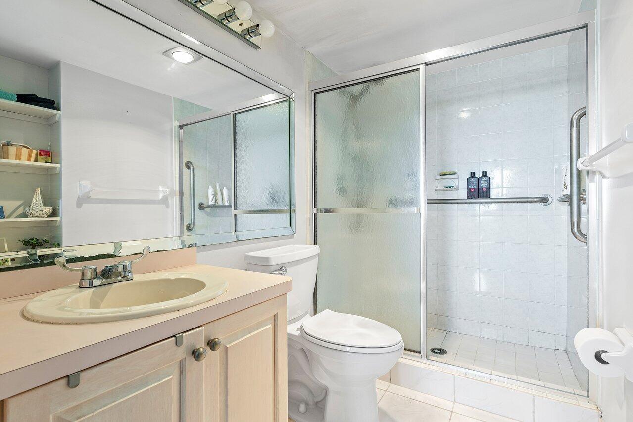 2611 North Riverside Drive, Unit 908 Pompano Beach, FL 33062 - Photo 31 of 43 a bathroom with a sink toilet and shower