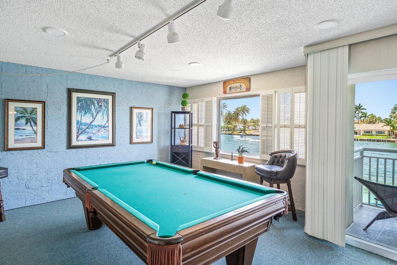 2611 North Riverside Drive, Unit 908 Pompano Beach, FL 33062 - Photo 37 of 43 a room with furniture pool table and windows