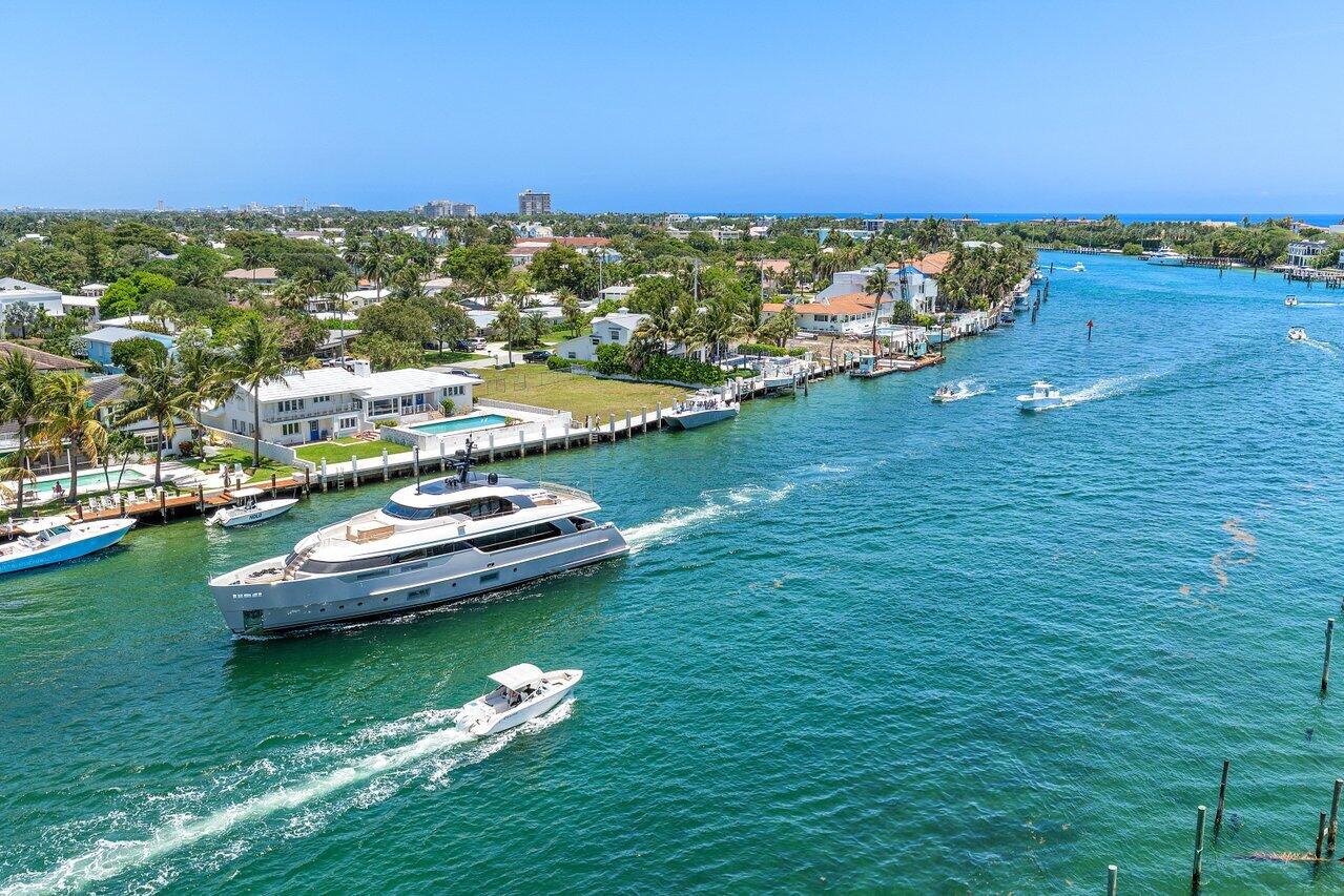 2611 North Riverside Drive, Unit 908 Pompano Beach, FL 33062 - Photo 5 of 43 a view of a lake with a city
