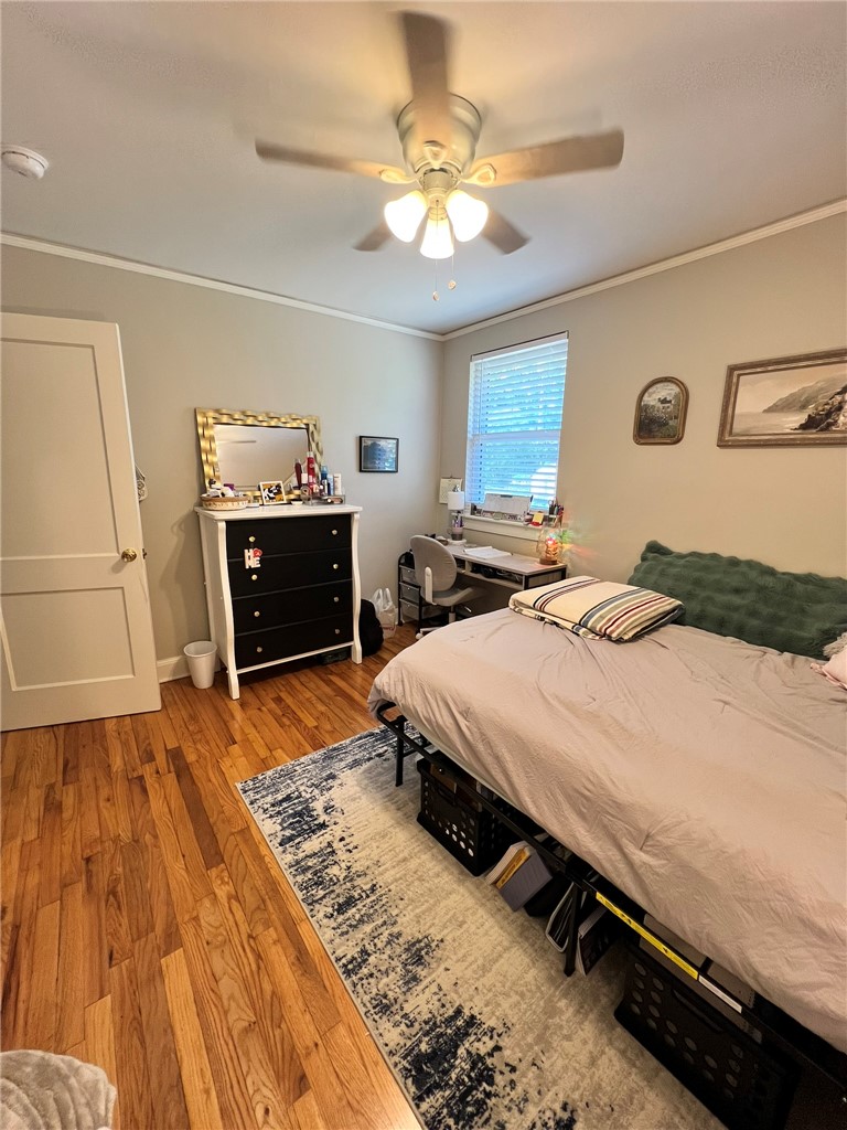 101 Clinton Drive, Unit B Anderson, SC 29621 - Photo 6 of 18 This cozy bedroom features hardwood floors and a ceiling fan for comfort.