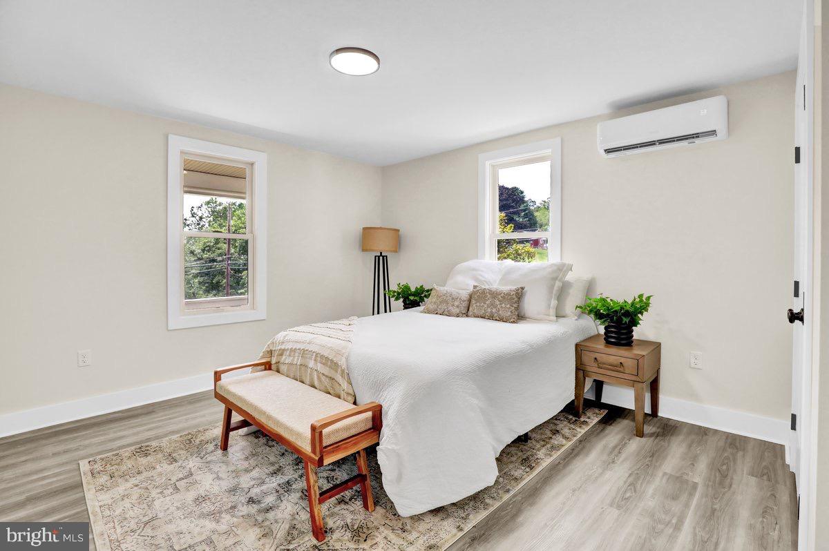 1069 Rawlinsville Road Willow Street, PA 17584 - Photo 13 of 47 a bedroom with a bed and window