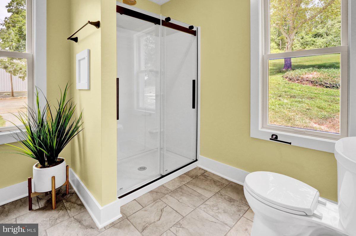 1069 Rawlinsville Road Willow Street, PA 17584 - Photo 15 of 47 a bathroom with a toilet and a shower