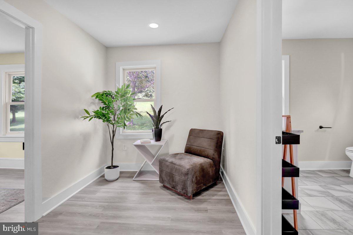 1069 Rawlinsville Road Willow Street, PA 17584 - Photo 19 of 47 a room with furniture and a potted plant