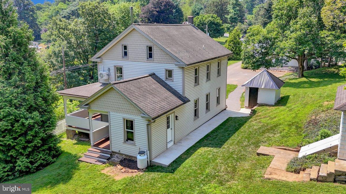 1069 Rawlinsville Road Willow Street, PA 17584 - Photo 2 of 47 a aerial view of a house with a yard table and chairs