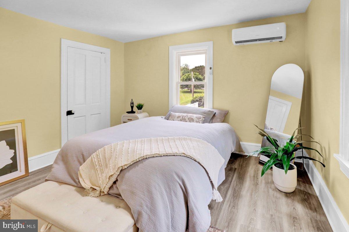 1069 Rawlinsville Road Willow Street, PA 17584 - Photo 24 of 47 a bed sitting in a bedroom next to a window