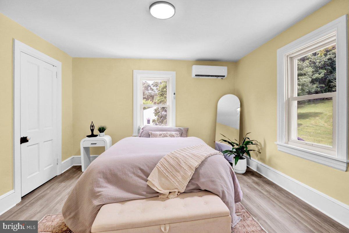 1069 Rawlinsville Road Willow Street, PA 17584 - Photo 25 of 47 a bedroom with a bed and a large window