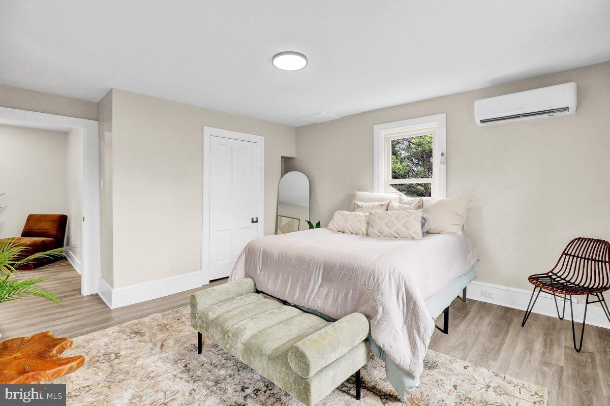 1069 Rawlinsville Road Willow Street, PA 17584 - Photo 27 of 47 a bedroom with a bed and wooden floor