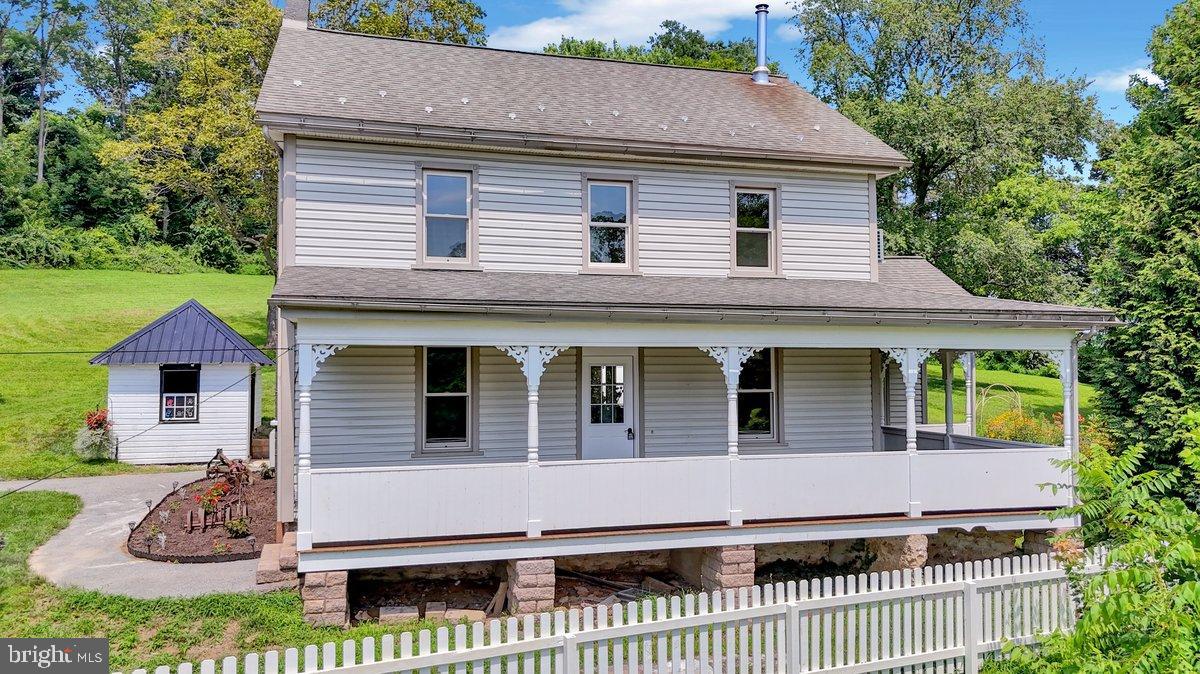 1069 Rawlinsville Road Willow Street, PA 17584 - Photo 3 of 47 a front view of a house with a yard