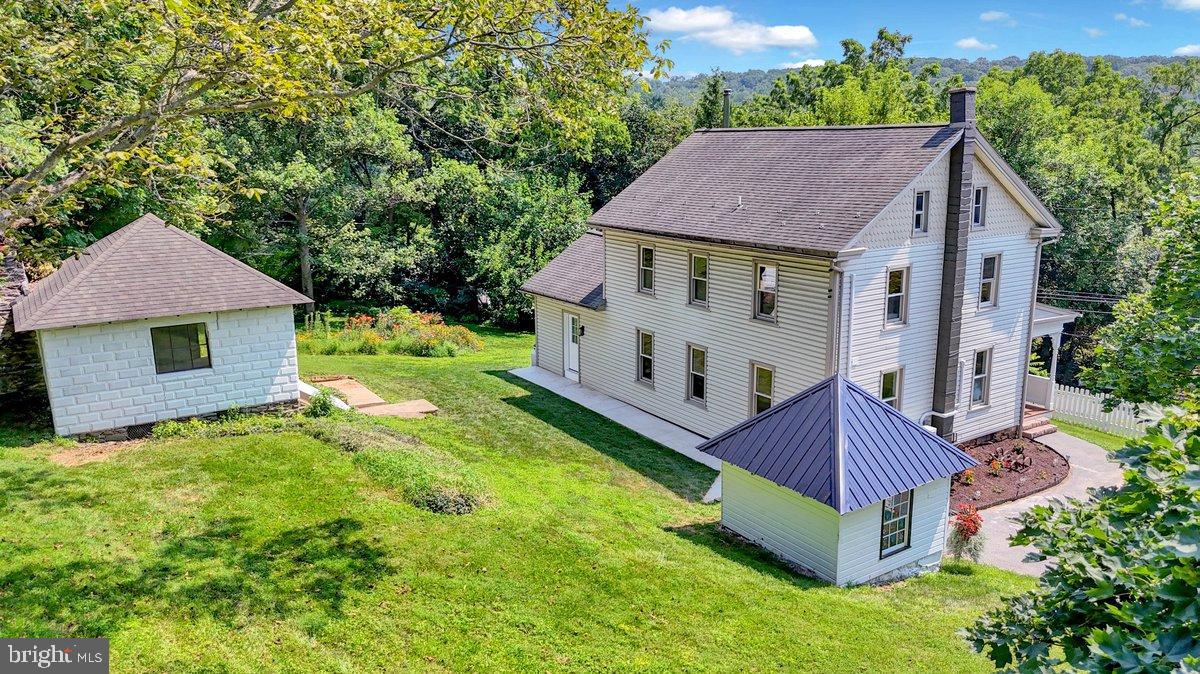 1069 Rawlinsville Road Willow Street, PA 17584 - Photo 31 of 47 a view of house with garden and tall trees