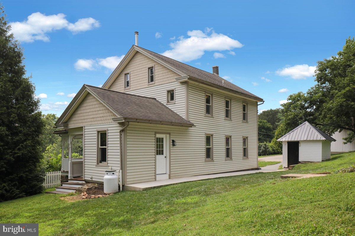 1069 Rawlinsville Road Willow Street, PA 17584 - Photo 43 of 47 a view of a house with a yard and wooden fence
